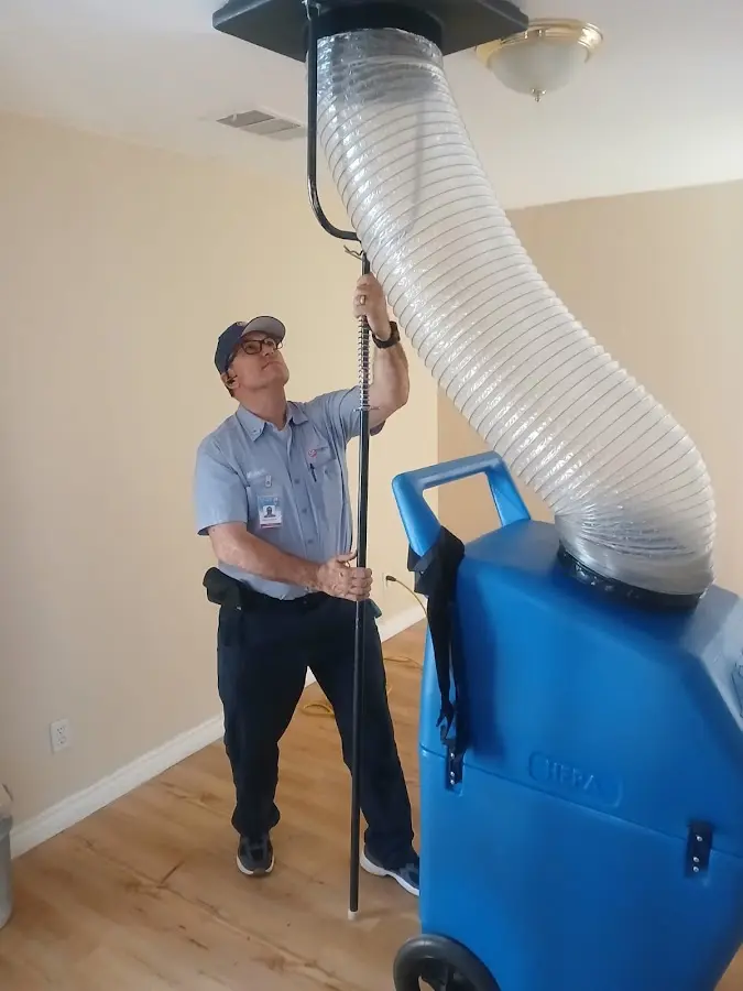 Furnace Tune-Up technician using HEPA equipment in Ocoee